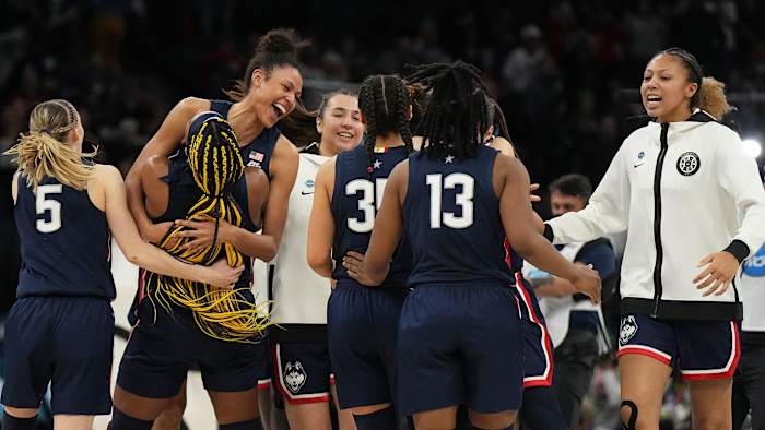 UConn players hug after beating Stanford